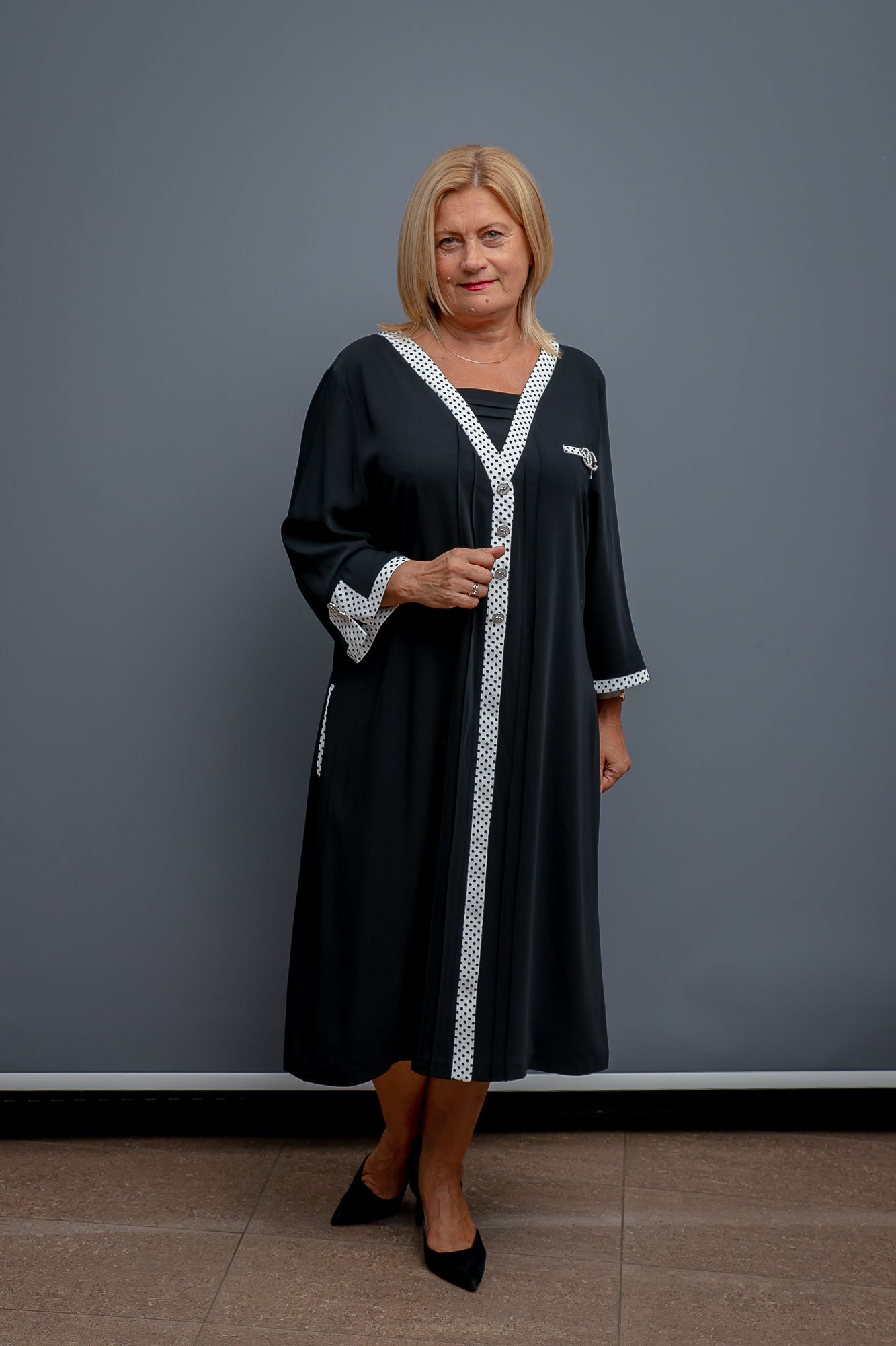 Melna kleita ar pumpiņām